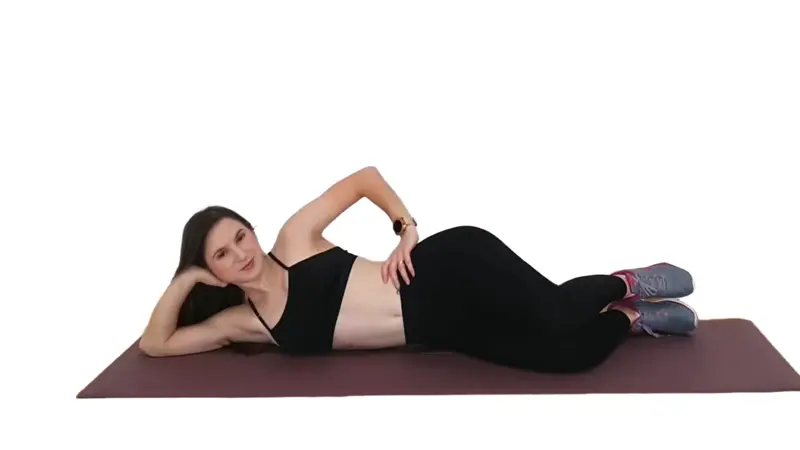 Person lying on their side with knees bent, lifting the top knee in a clamshell motion to strengthen hips and glutes.