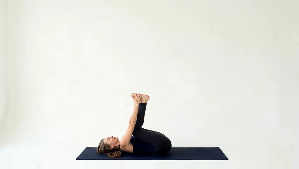 Happy baby pose, lying on the back holding the outer edges of the feet with knees drawn toward the floor to ease lower back tension