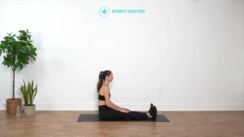 Person sitting upright in a seated spinal twist, gently stretching the piriformis and lower back muscles for improved hip mobility.