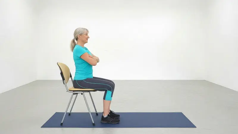 Person standing up from a chair during a sit-to-stand exercise to build hip strength and stability.