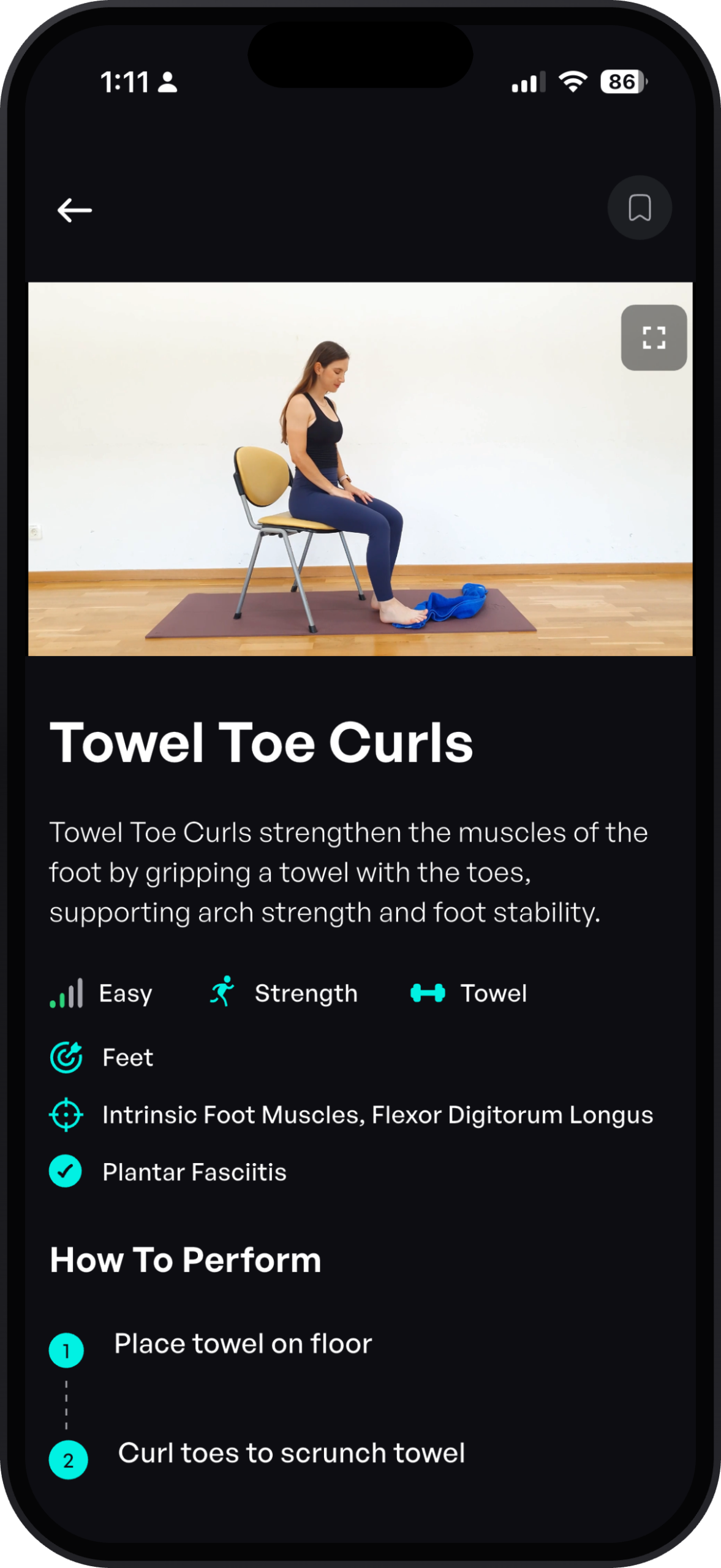 Woman doing seated towel toe curls in the Sporty Doctor plantar fasciitis protocol